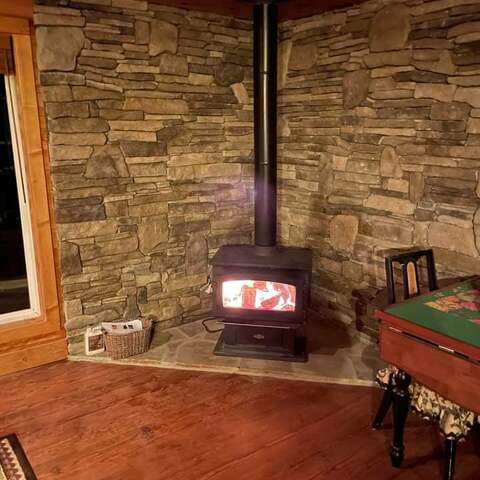 Stone hearth and corner wall behind a wood stove